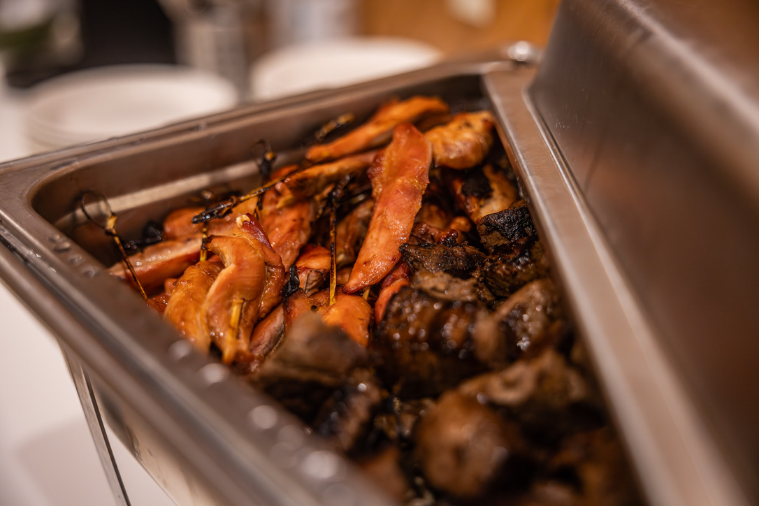 Chafing dish of bacon-wrapped game bites