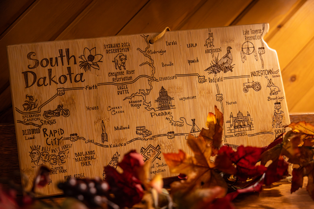 A carved wooden map of South Dakota on the lodge wall