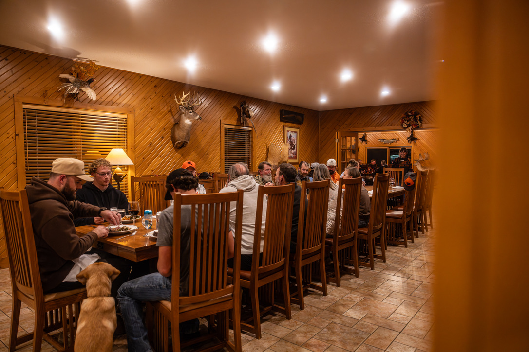 The lodge dining room full of guests over dinner