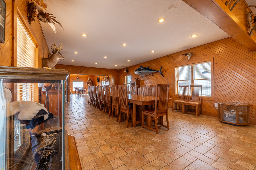 The lodge's long dining hall with mounted trophies